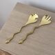 Gold metal snake salad serving set