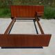 Vintage bed in teak with integrated bedside table.