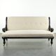 French sofa from the 19th century in Empire style with detailed armrests