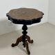 Two-tone black and mahogany pedestal table with mahogany veneer