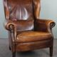 Dark wingback armchair made of sheep leather with stunning colors