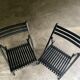 Pair of black folding chairs