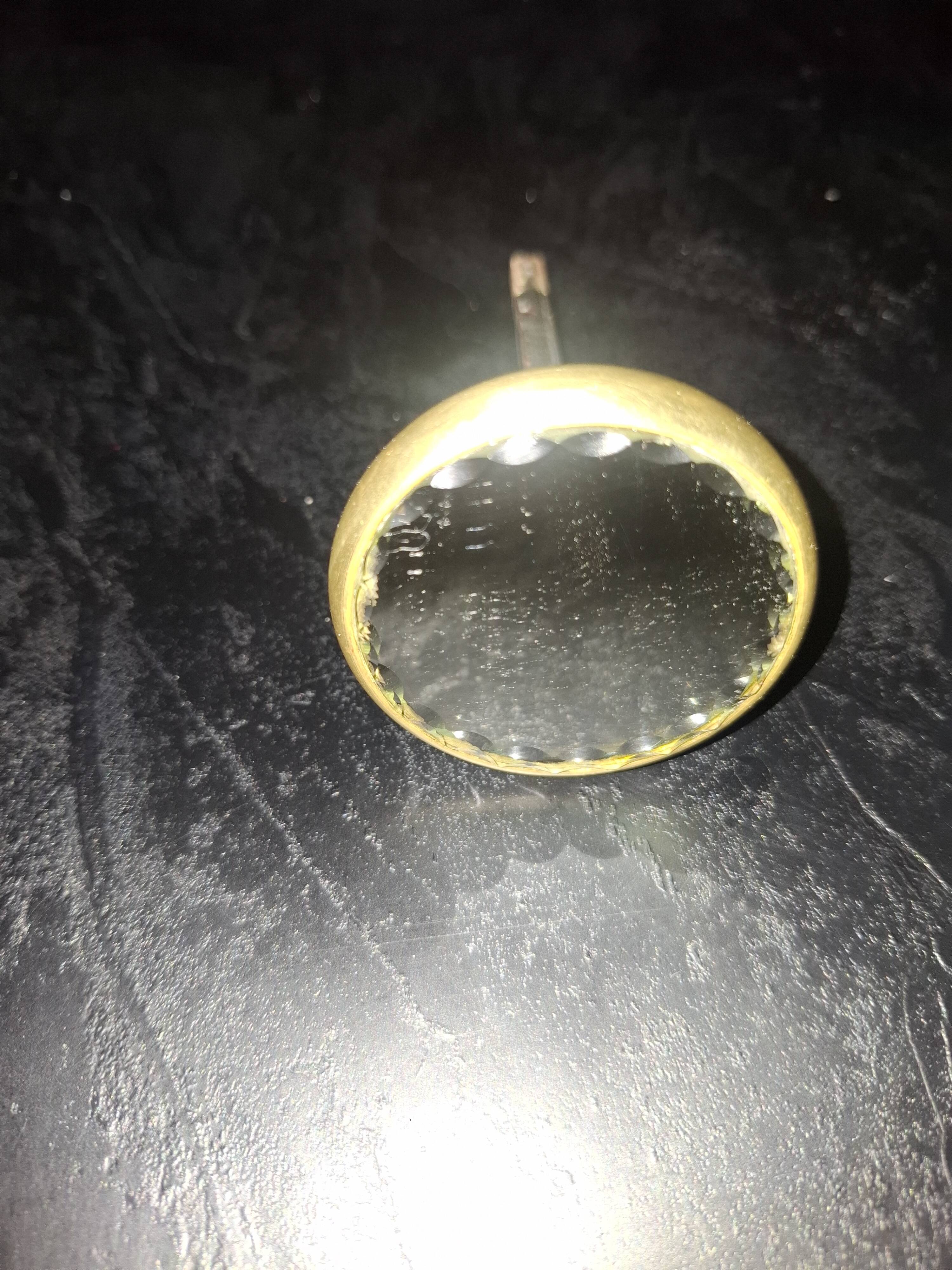 Sublime door handle made of brass with a bevelled mirror front.