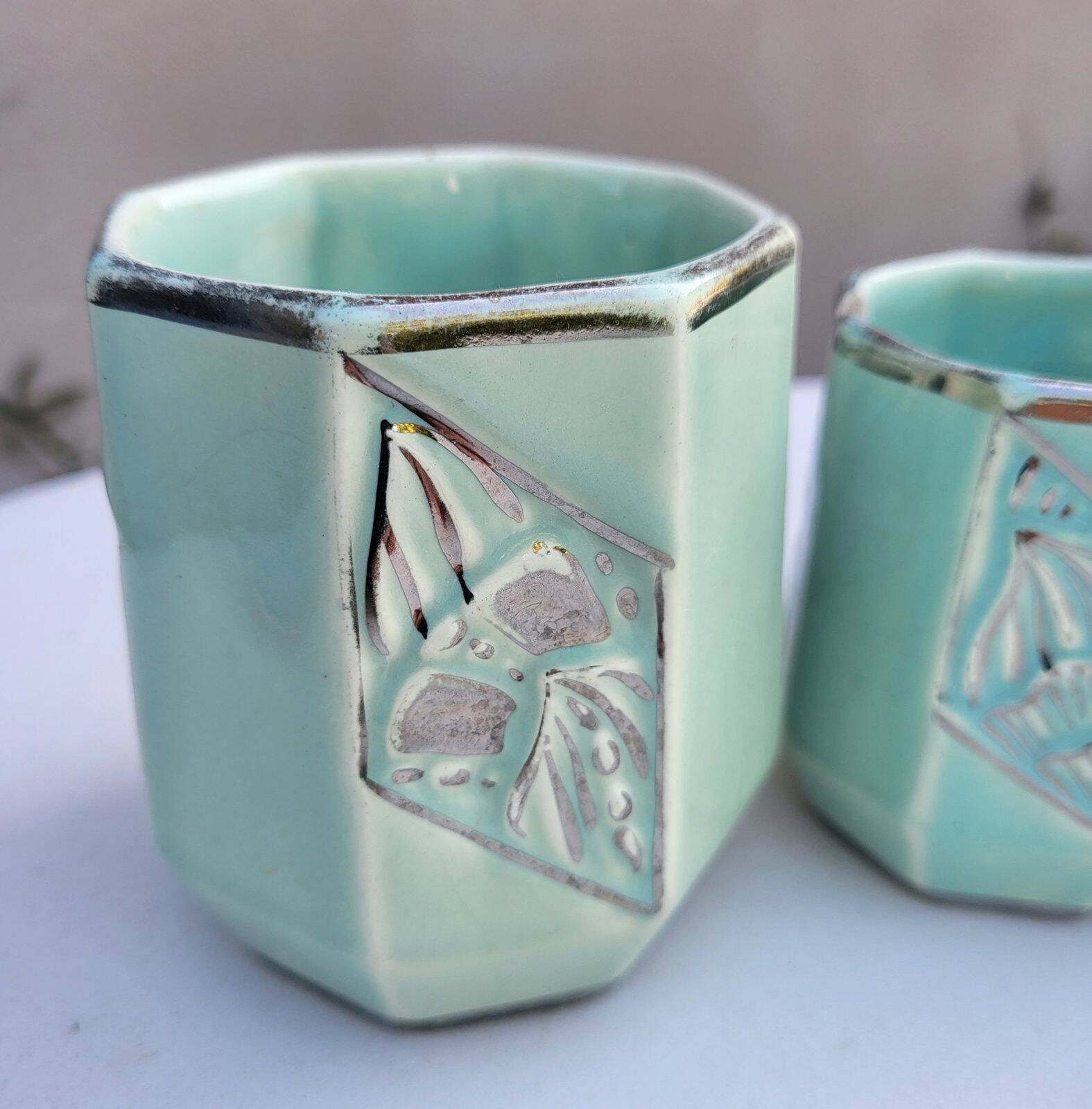 Set of 4 Art Deco celadon green and silver barbotine pots.