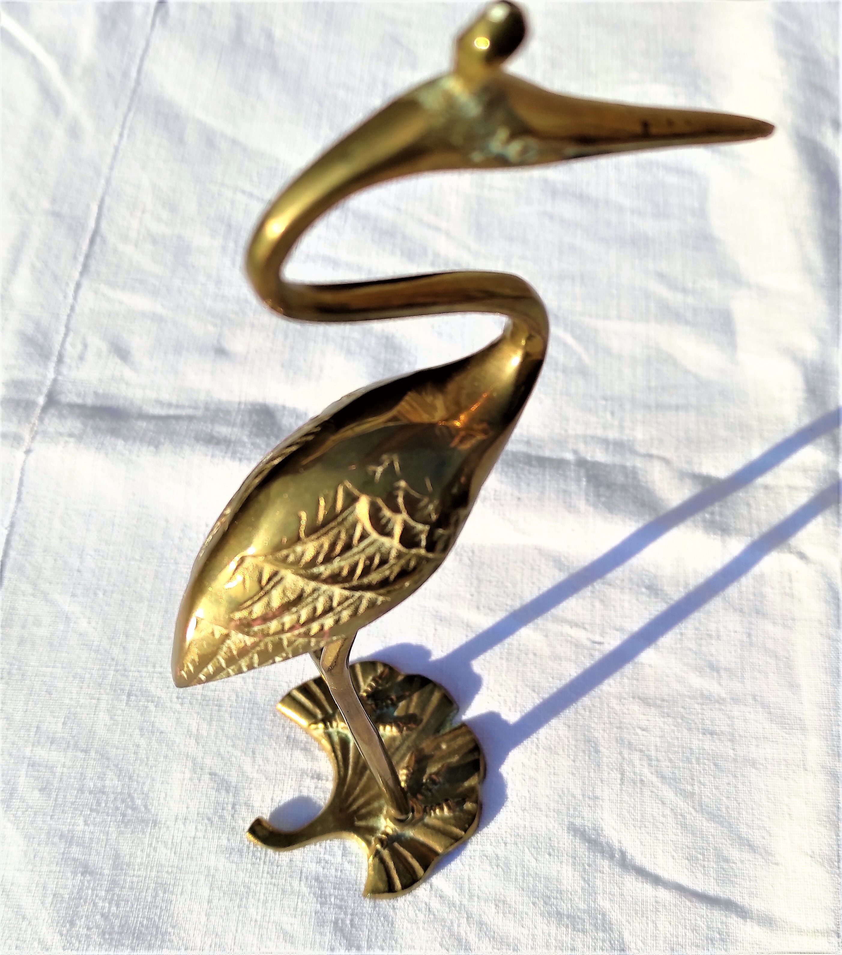 Heron or brass wading bird around the 1960s/1970s