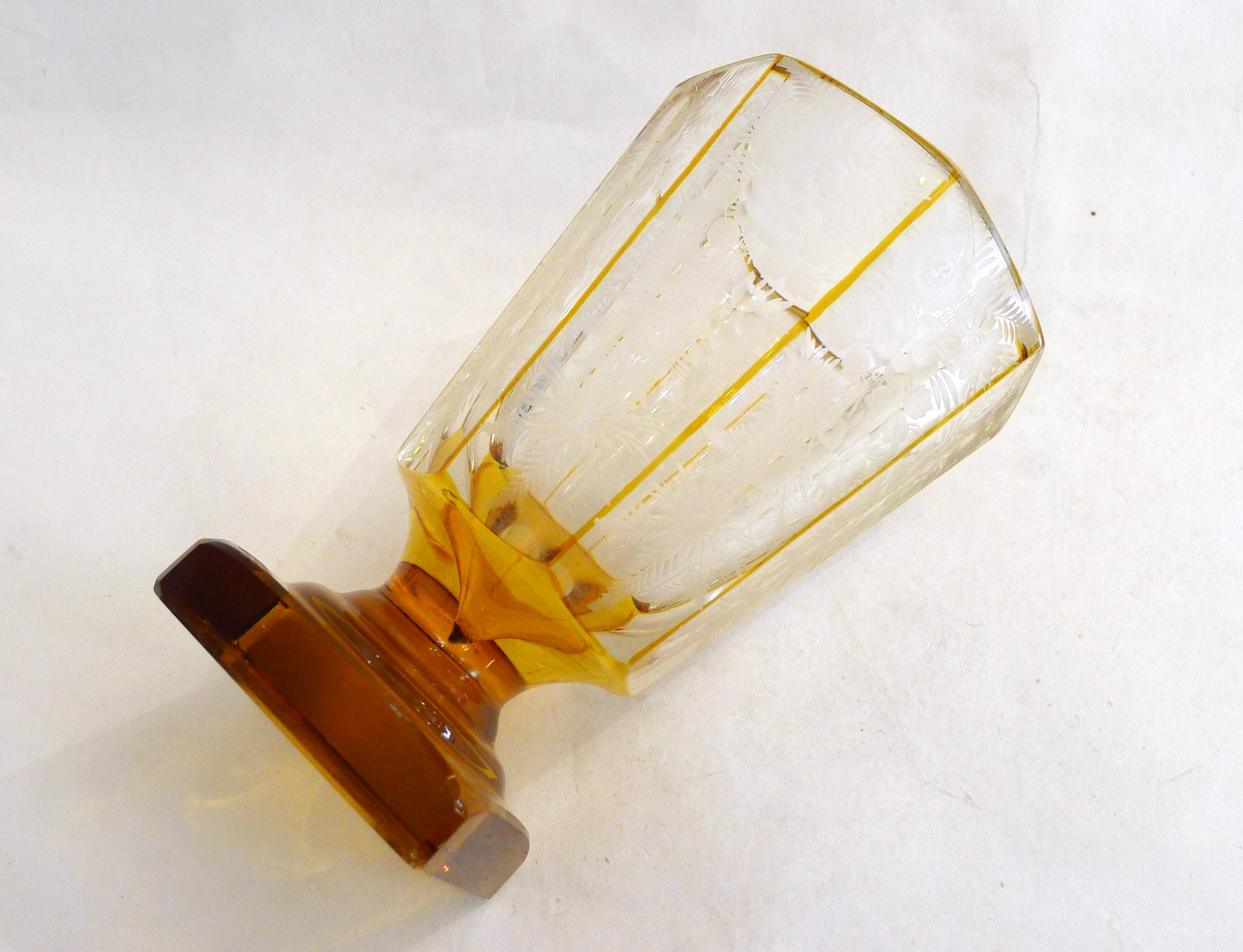 Art Deco vase engraved with flowers, faceted body on a pedestal.