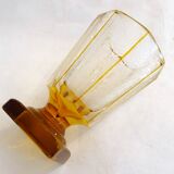 Art Deco vase engraved with flowers, faceted body on a pedestal.