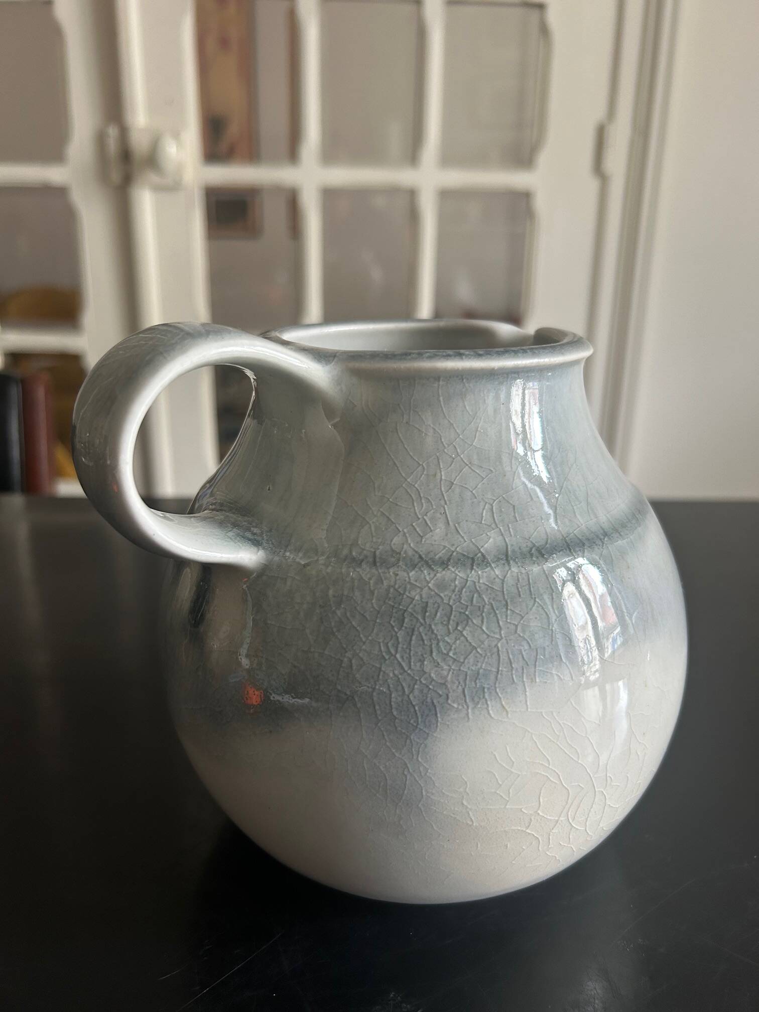 large blue ceramic pitcher