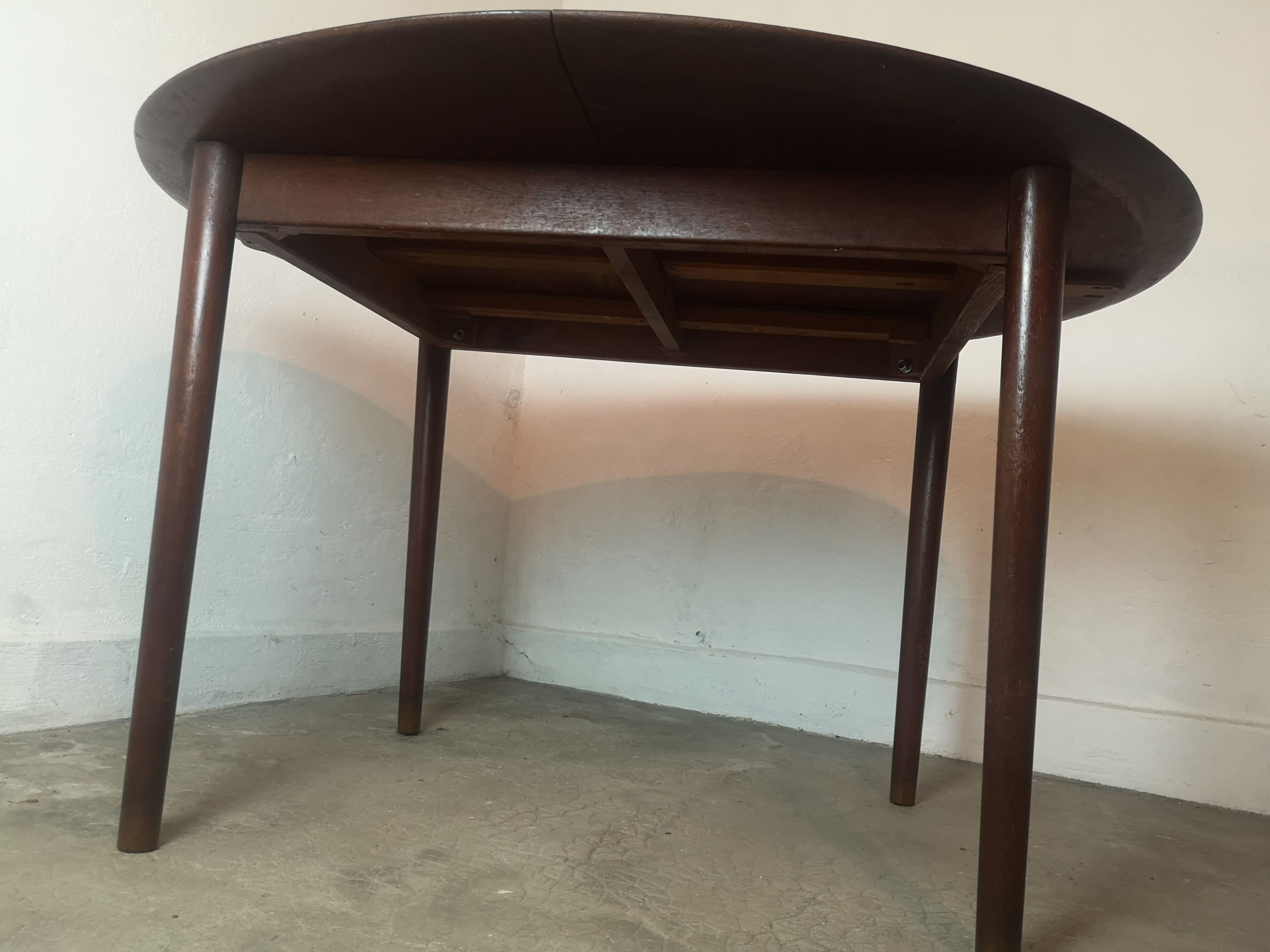 Scandinavian extendable round dining table in teak