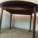 Scandinavian extendable round dining table in teak