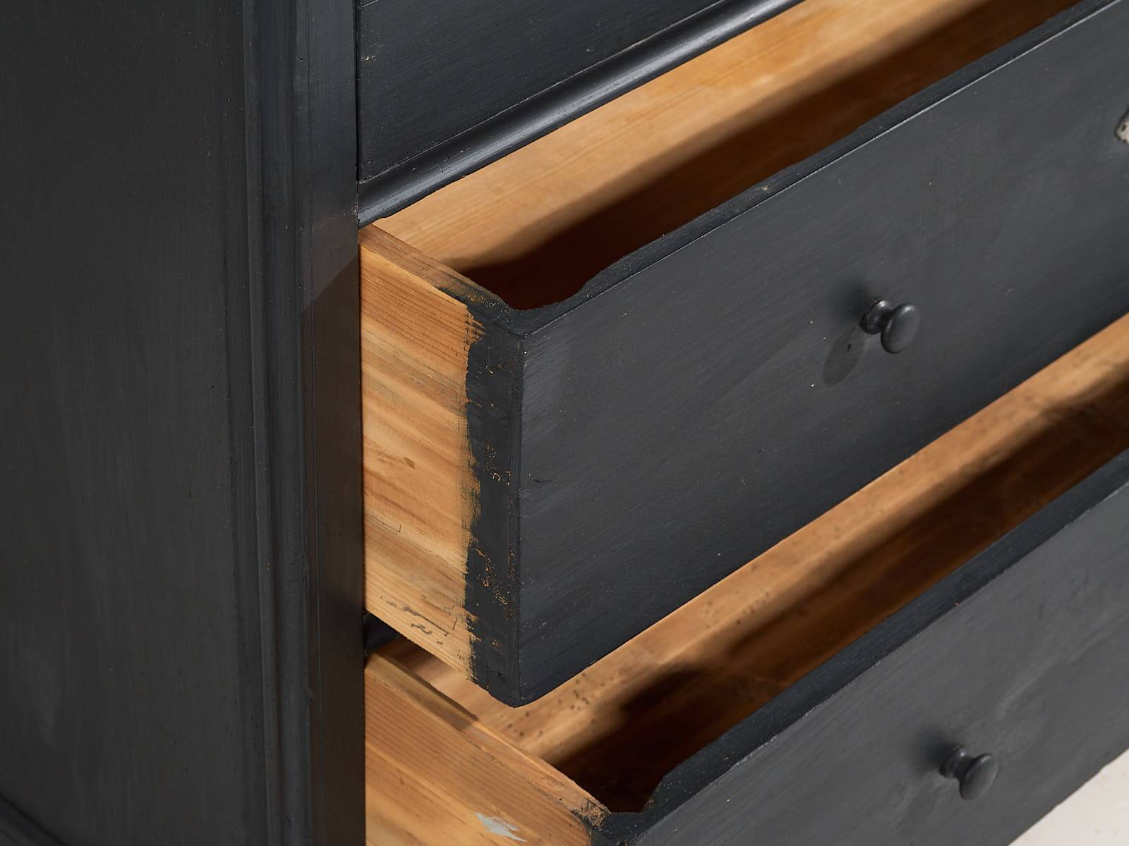 Antique chest of drawers in dark tones (c.1920)