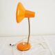 Orange colored metal desk lamp from the 1960s-1970s