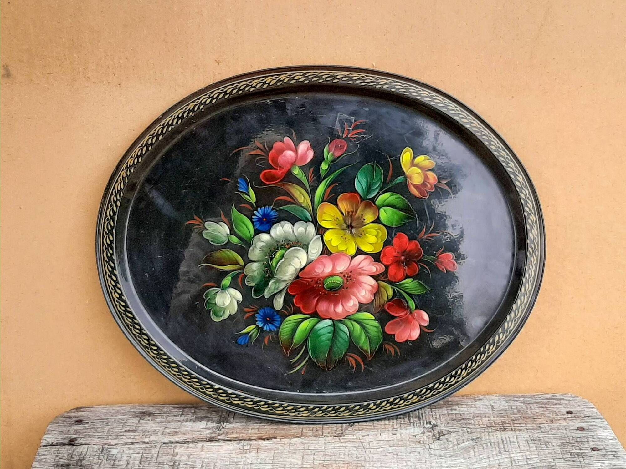 Black lacquered metal tray with multicoloured vintage Russian floral decoration.