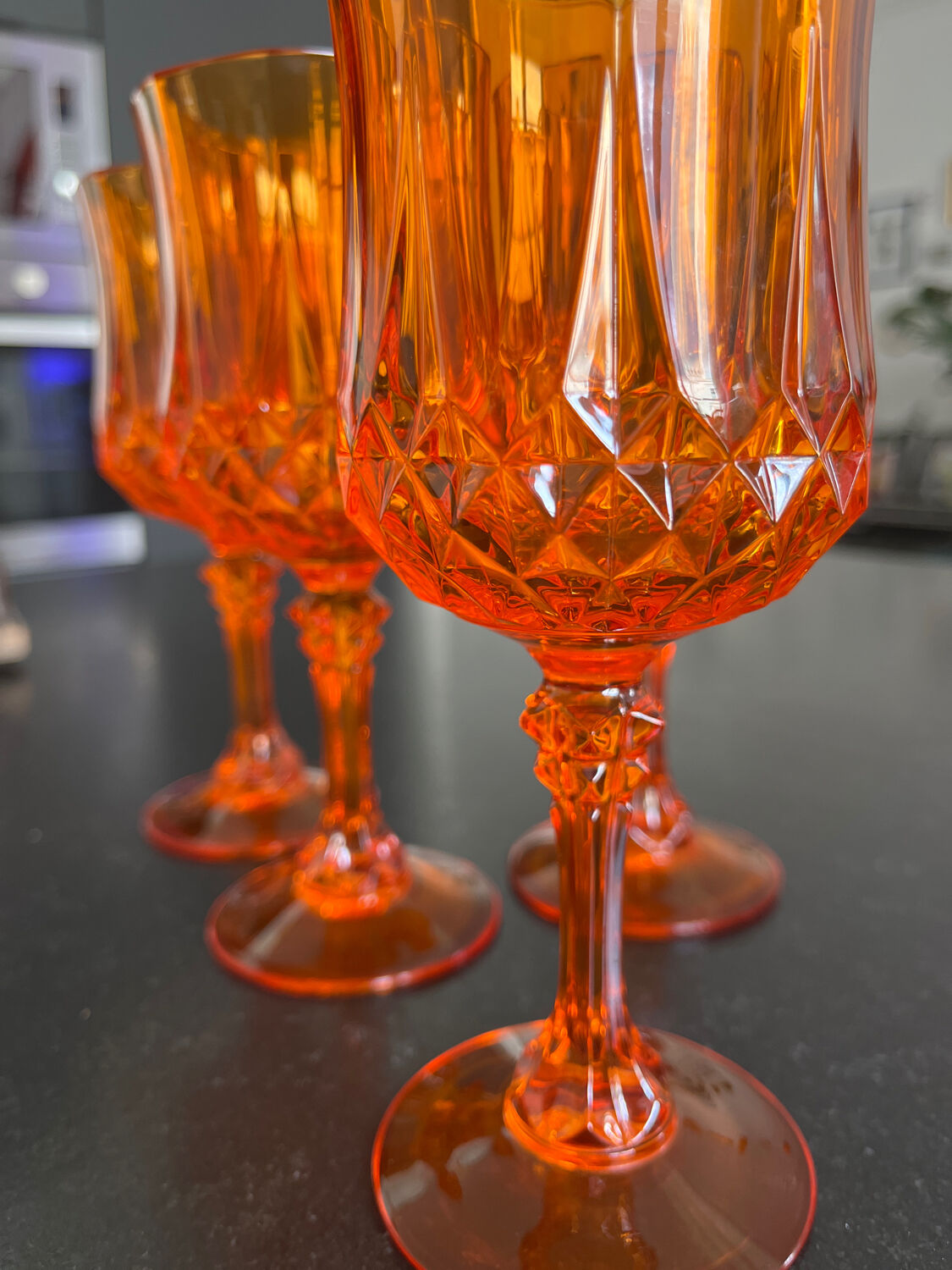 4 orange crystal glasses