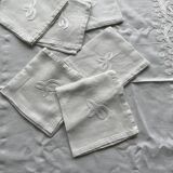 White hand-embroidered square tablecloth at stem stitch