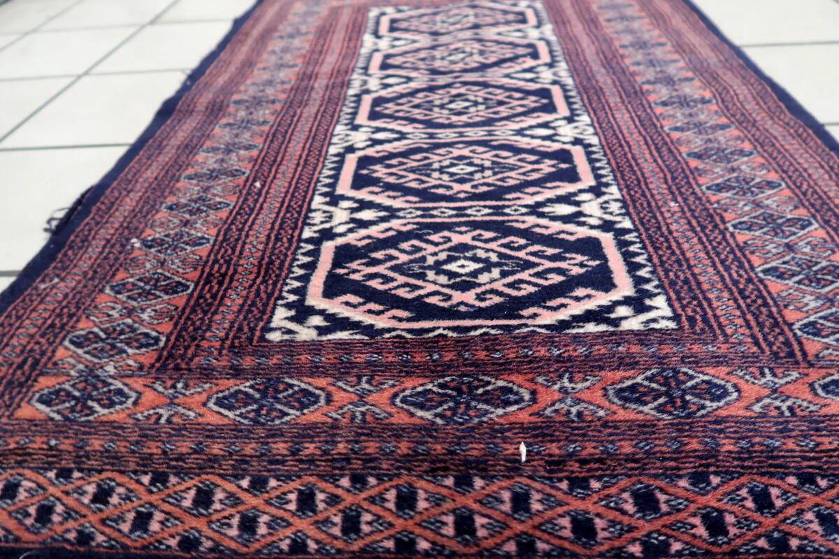 Handmade vintage 1960s Uzbek Bukhara rug – small wool tribal carpet (65cm x 95cm)