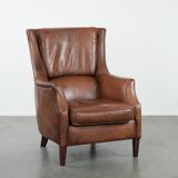 Cognac brown cow leather armchair with decorative nail finish