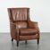Cognac brown cow leather armchair with decorative nail finish