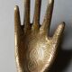 Empty-pocket brass hand