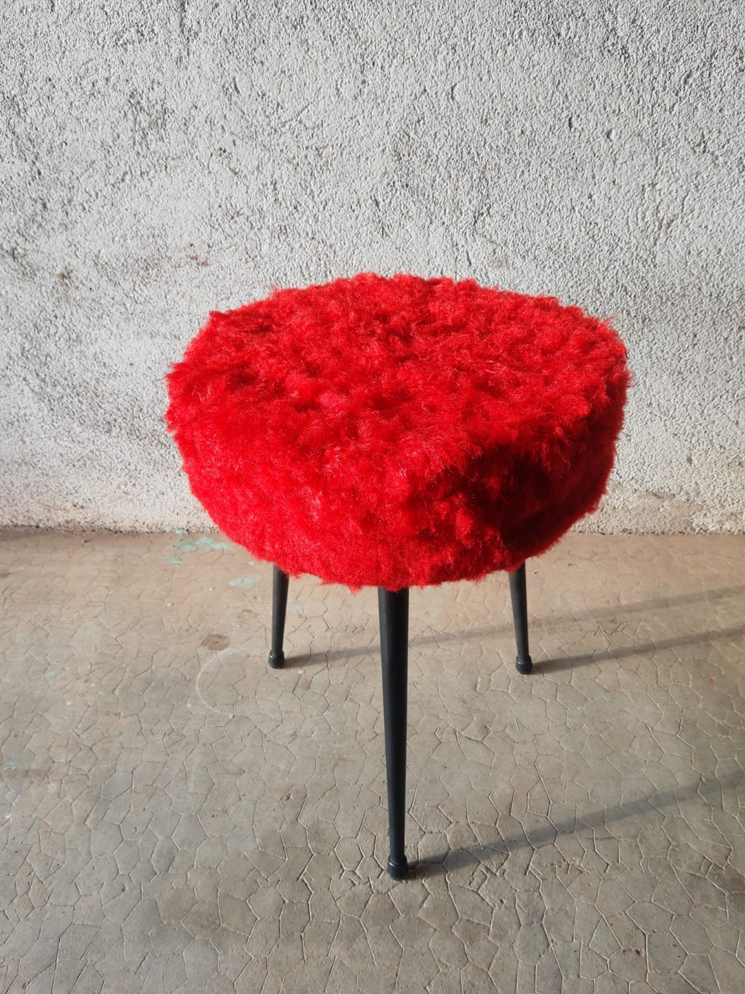 Tripod stool with vintage red moumoute seat