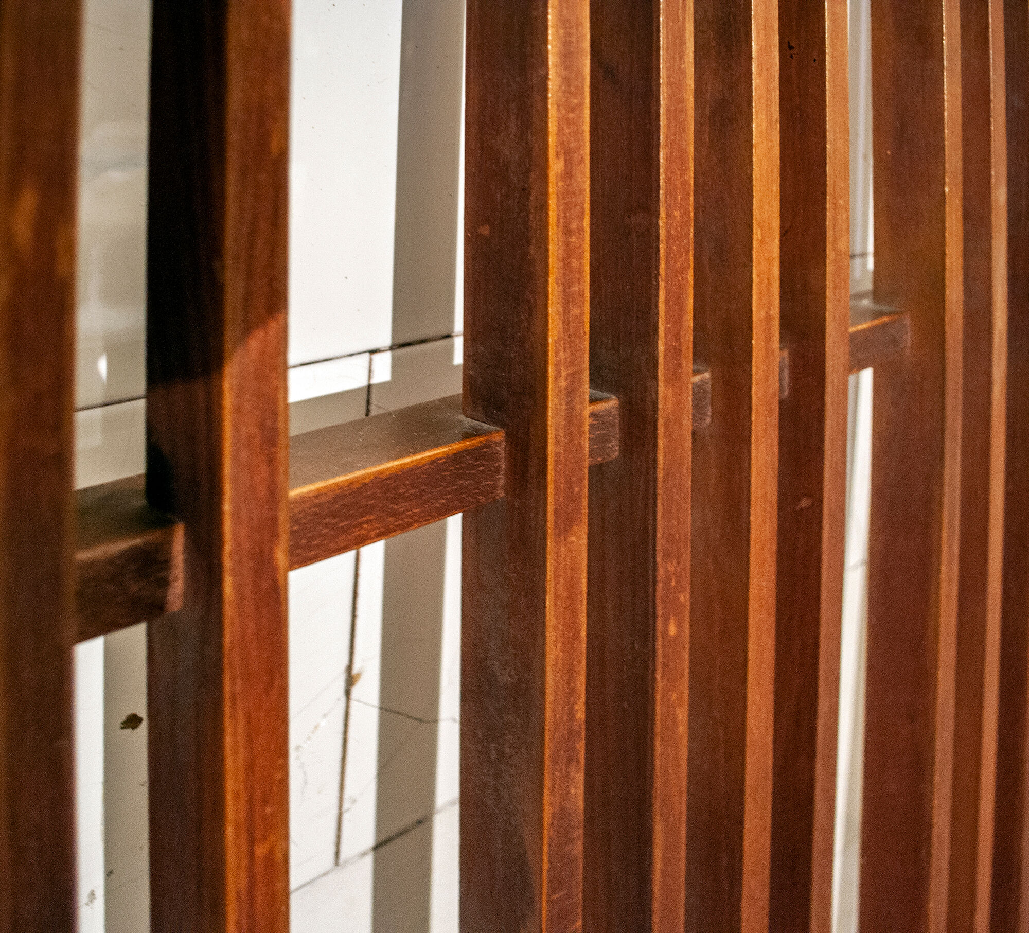 Walnut wood wall coat hangers, with metal details. Italian production 1950s