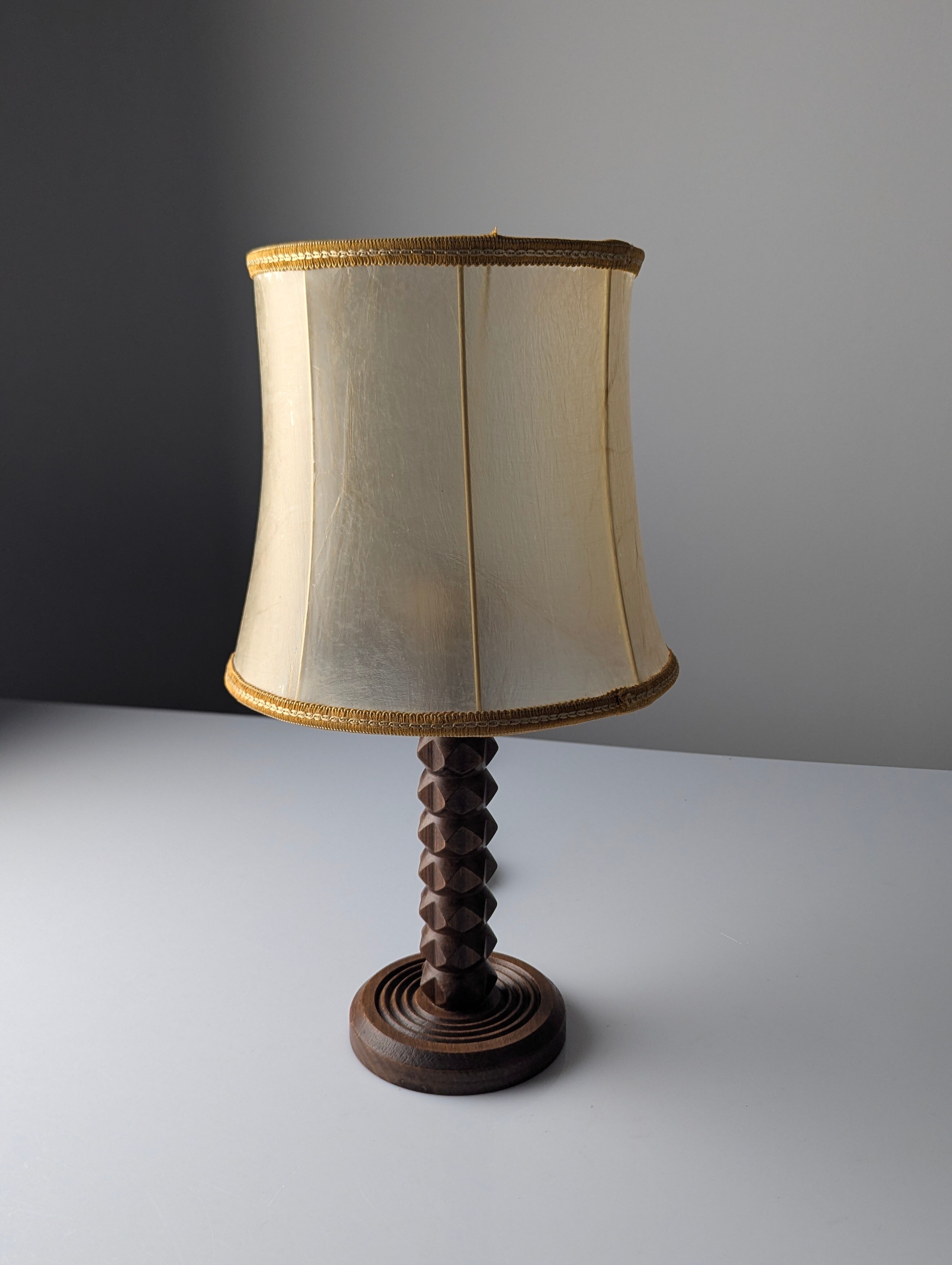 Charles Dudouyt oak table lamp with parchment shade, France, 1950s