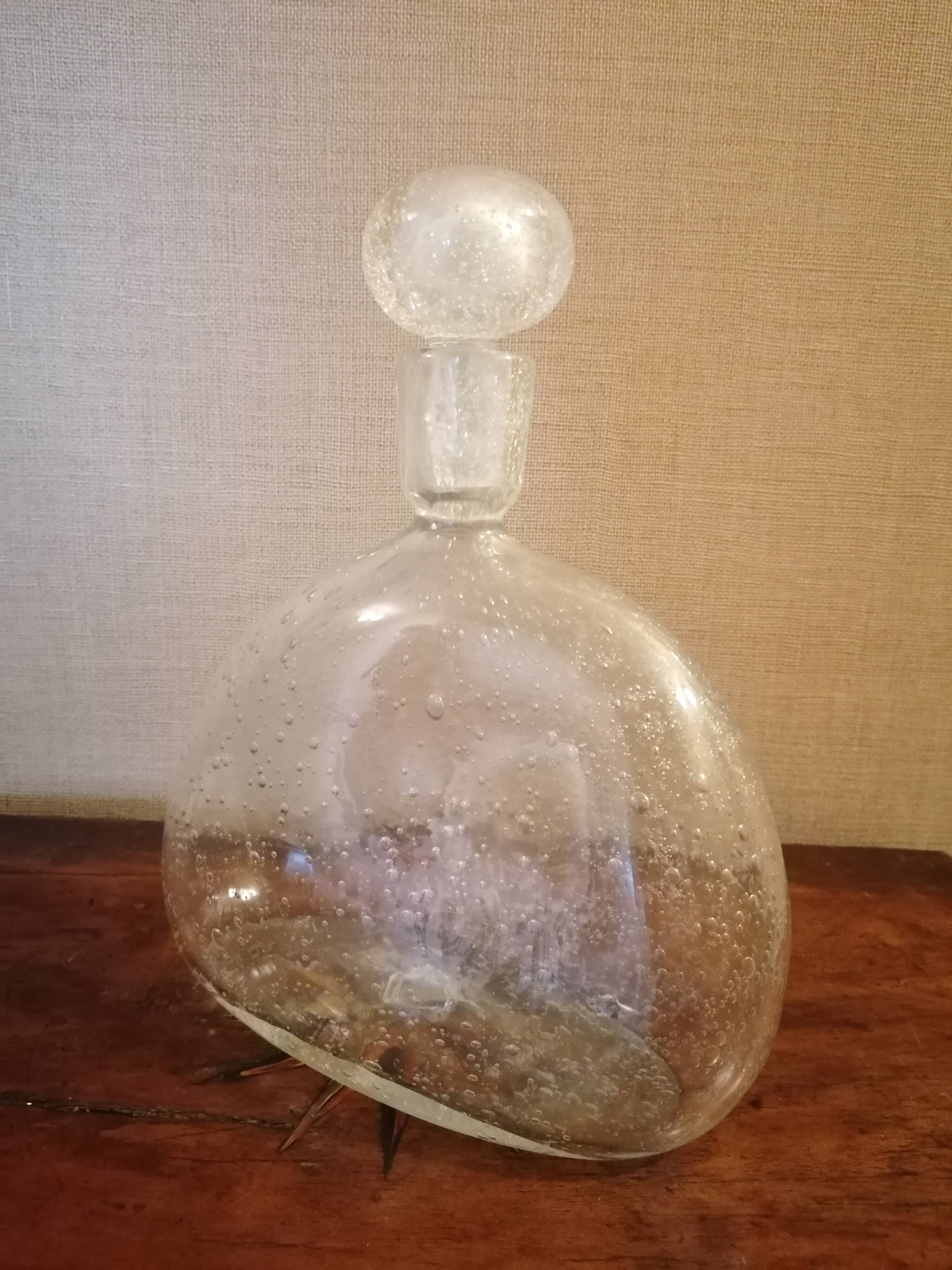 Clear bubble glass bottle molded for easy manual gripping