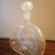 Clear bubble glass bottle molded for easy manual gripping