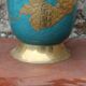 Vintage turquoise brass champagne bucket with grape decoration.