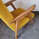 Curly yellow Scandinavian armchair