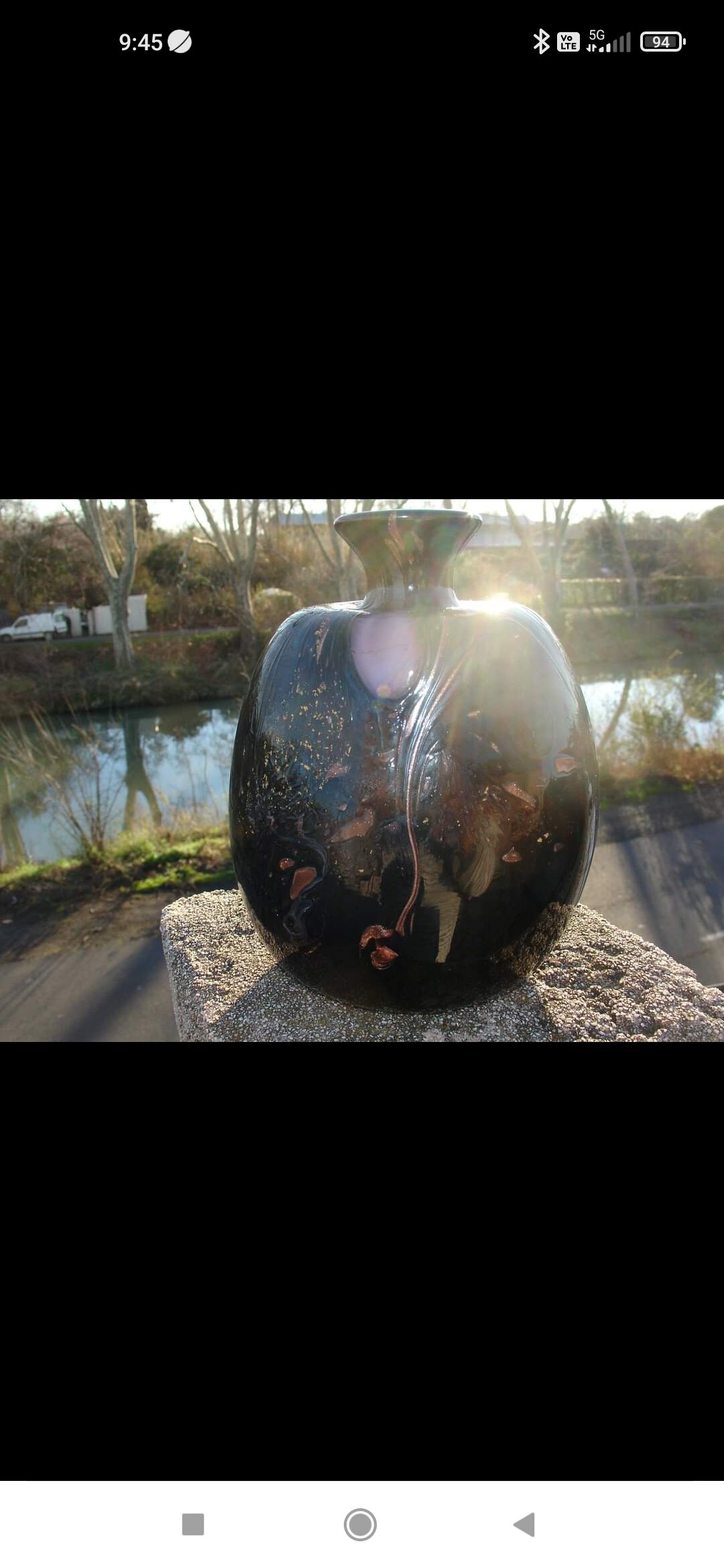 Vase in multi-layered black glass paste with inclusions of gold and other colors, signed by Bob le Bleïs