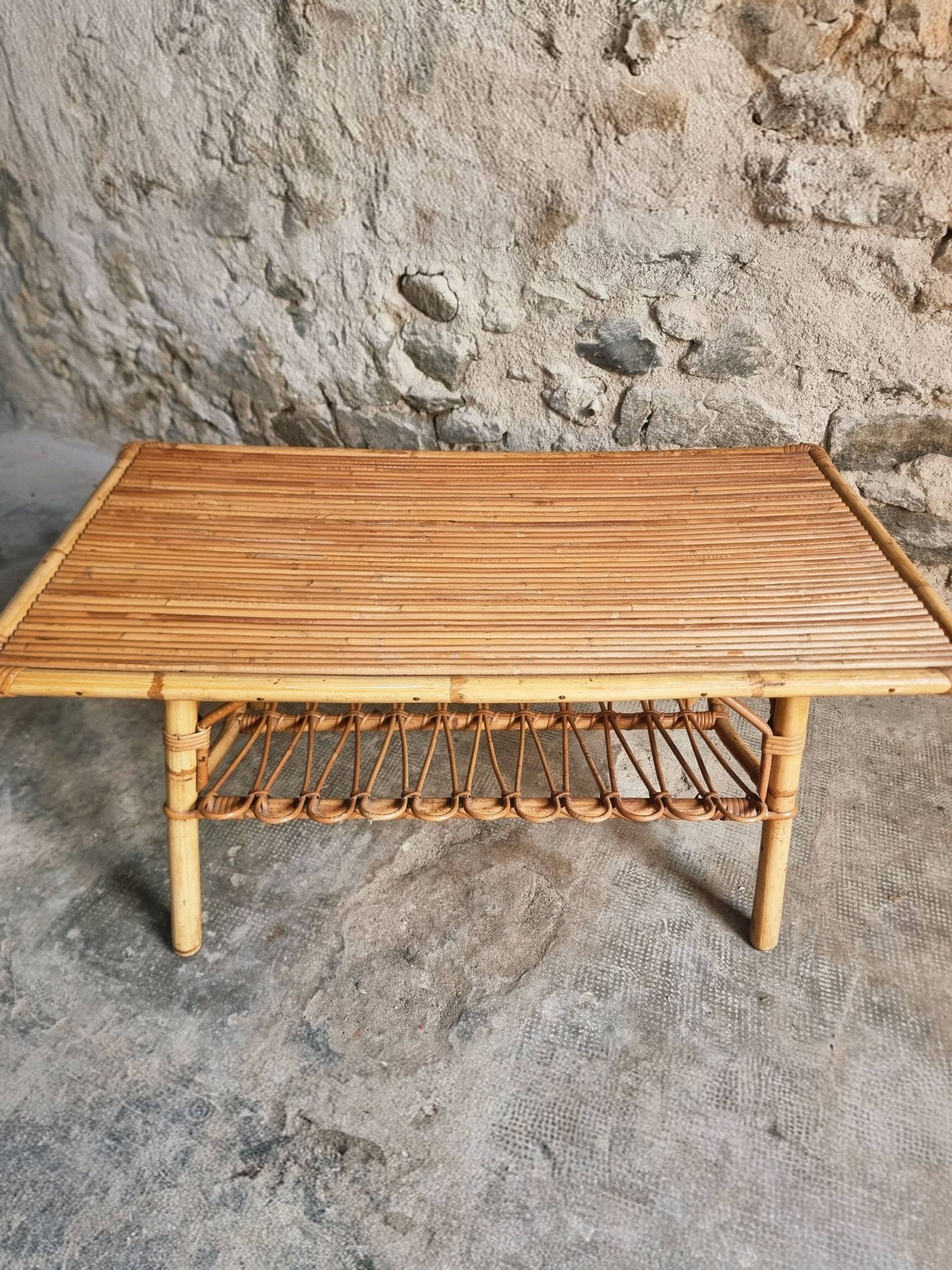 Vintage bamboo and rattan coffee table with magazine rack, French, circa 1960–1970.