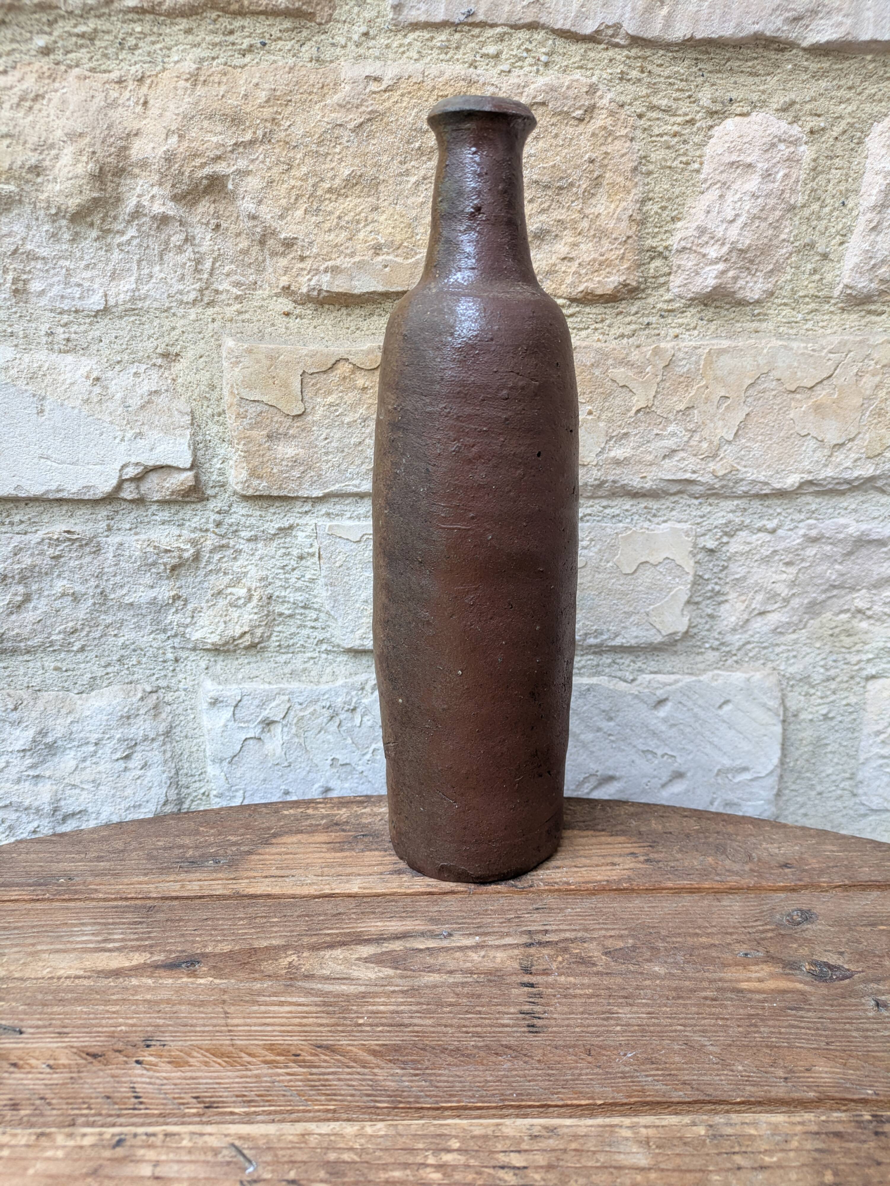 Old handmade terracotta bottle