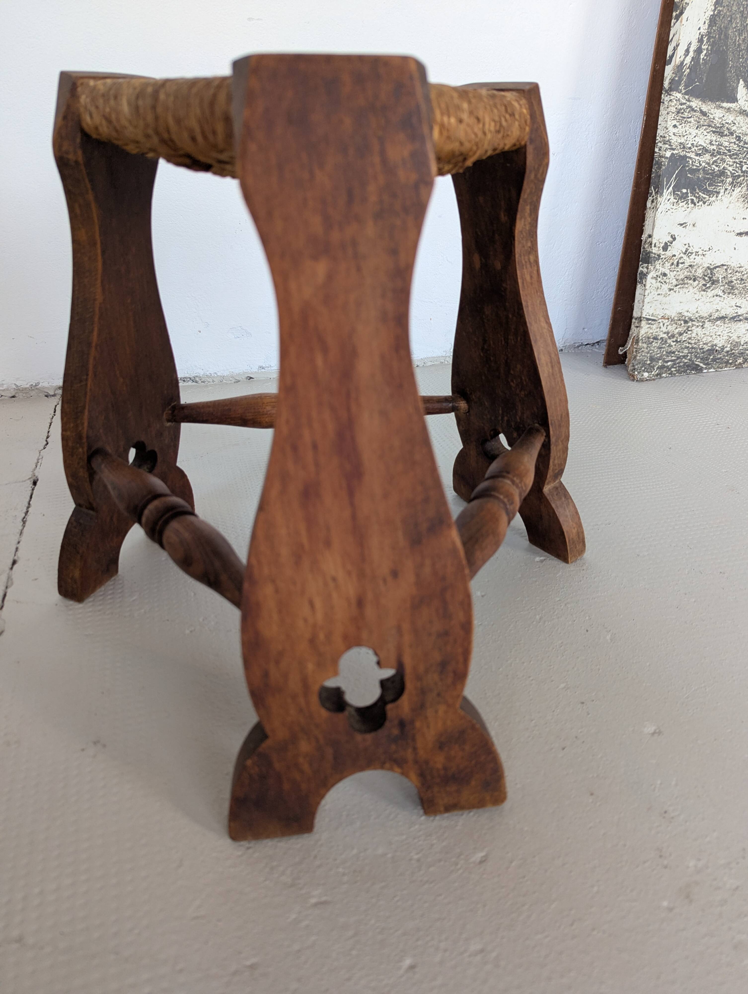 Low tripod farm stool in wood and straw