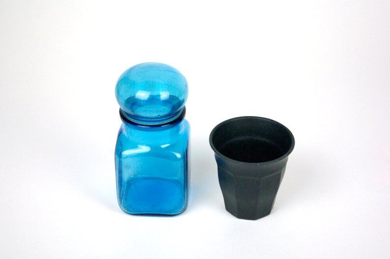 Bottle of pharmacy with screw lid in blue thick glass