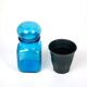 Bottle of pharmacy with screw lid in blue thick glass