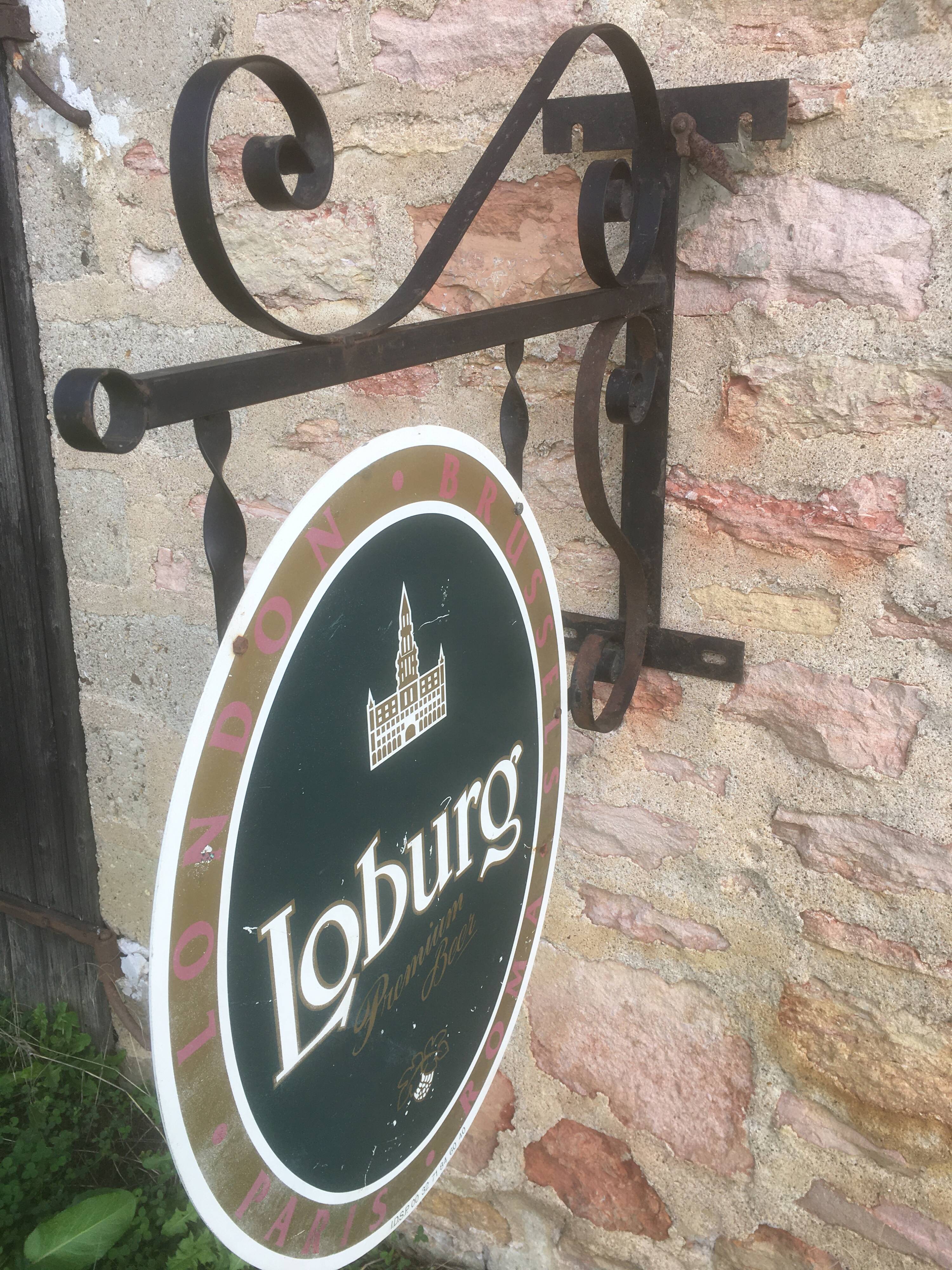 Double-sided "Loburg Beer" metal sign on wrought iron bracket