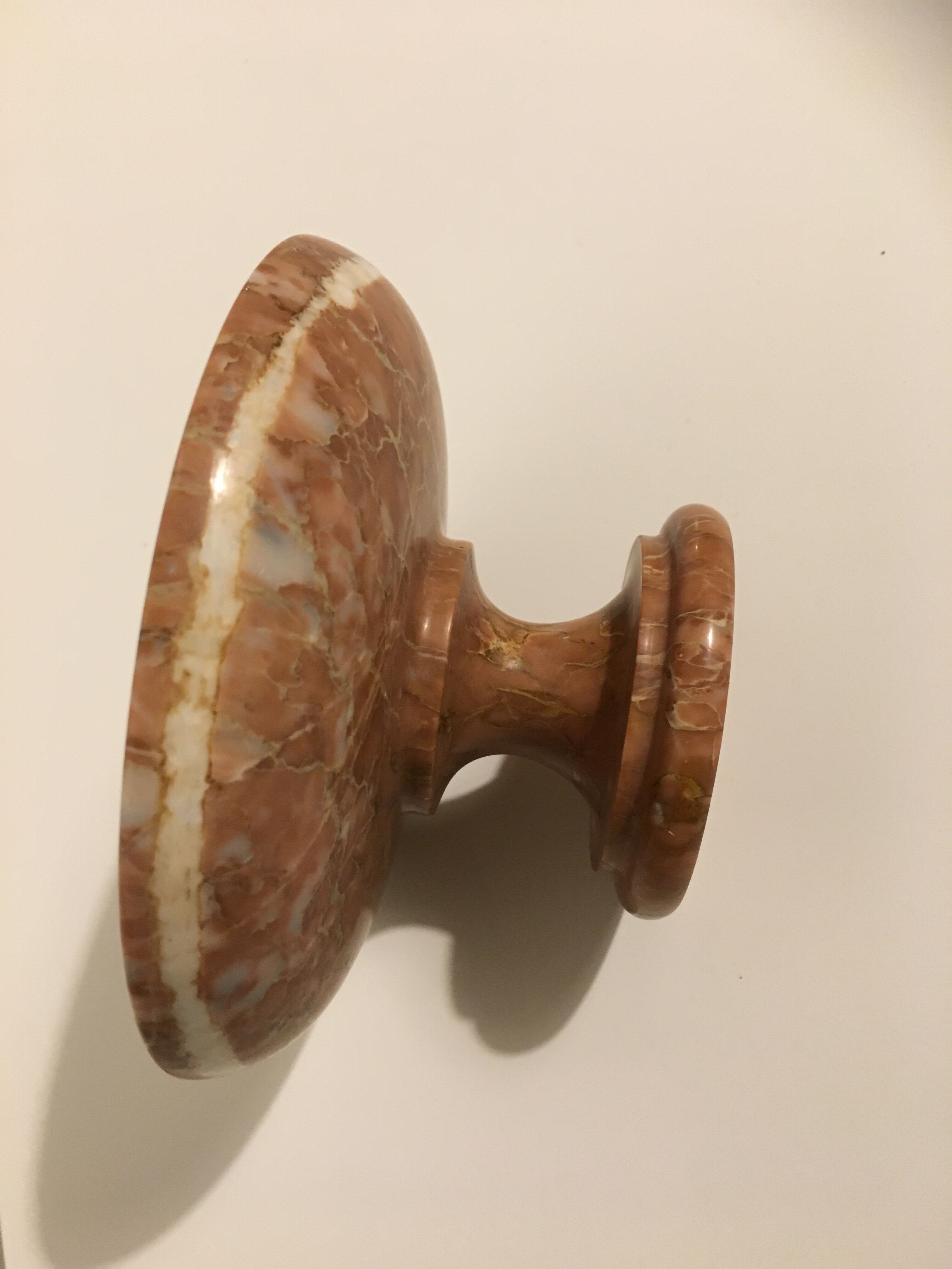 Empty pocket on foot in red marble