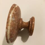 Empty pocket on foot in red marble