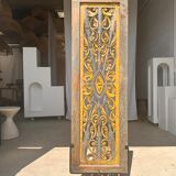 Rectangular Indonesian construction element with blue and yellow plant in carved wood