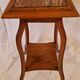 Antique Art Nouveau pedestal table with carved wood and marble top.