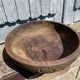 Old carved wooden bowl with African decoration.