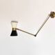 Articulated brass and lacquered iron wall light, 1950s design.