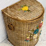 Vintage wicker mannequin with colourful floral decoration.