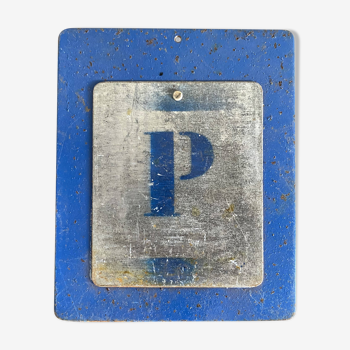 Letter P on metal plates