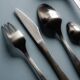 GUY DEGRENNE STAINLESS STEEL CUTLERY SET, 1970s