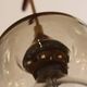 Scandinavian chandelier "Cascade" from the 1960s in brass, teak, and smoked glass.