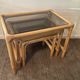 Trio of vintage pull-out tables in rattan and smoked glass 70s