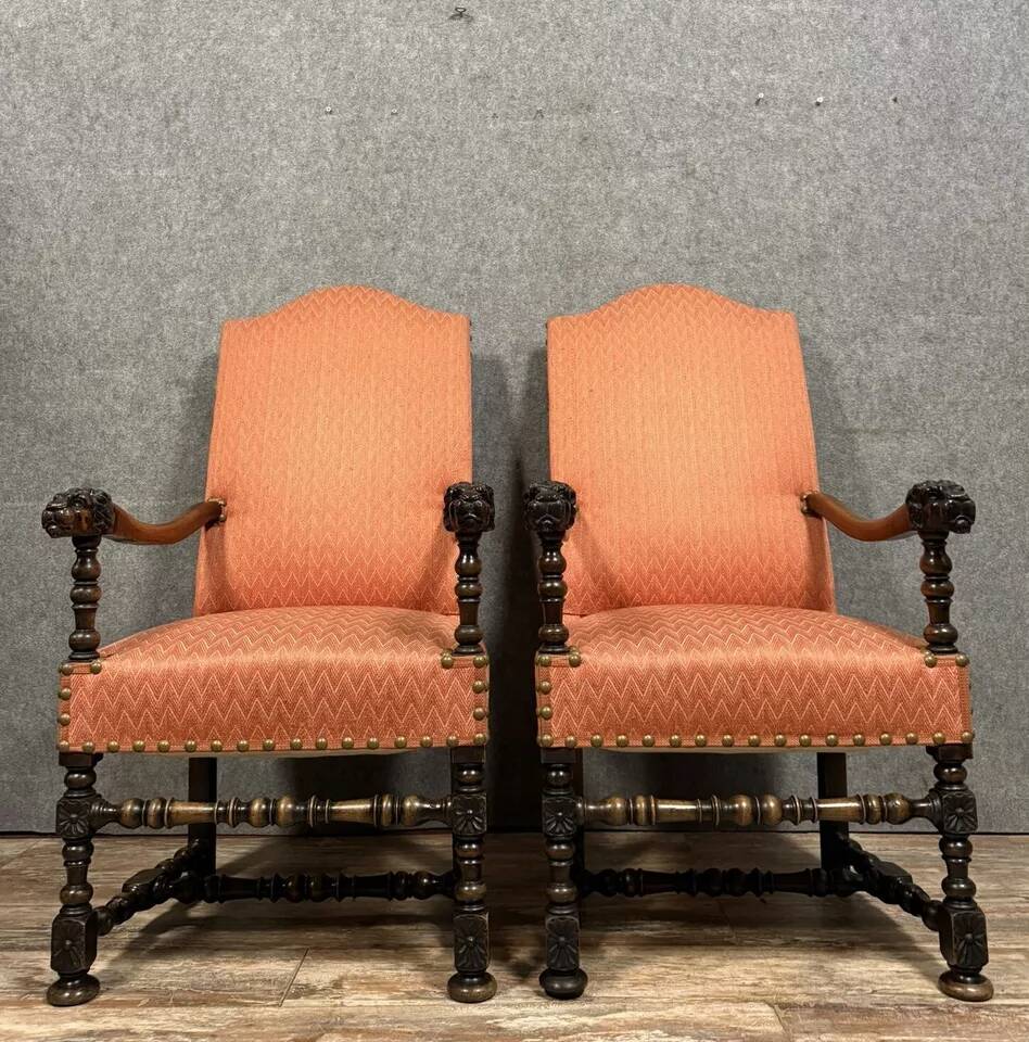 Pair of Louis XIII style armchairs in carved walnut circa 1850