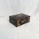 Old black wooden box adorned with roses with keys